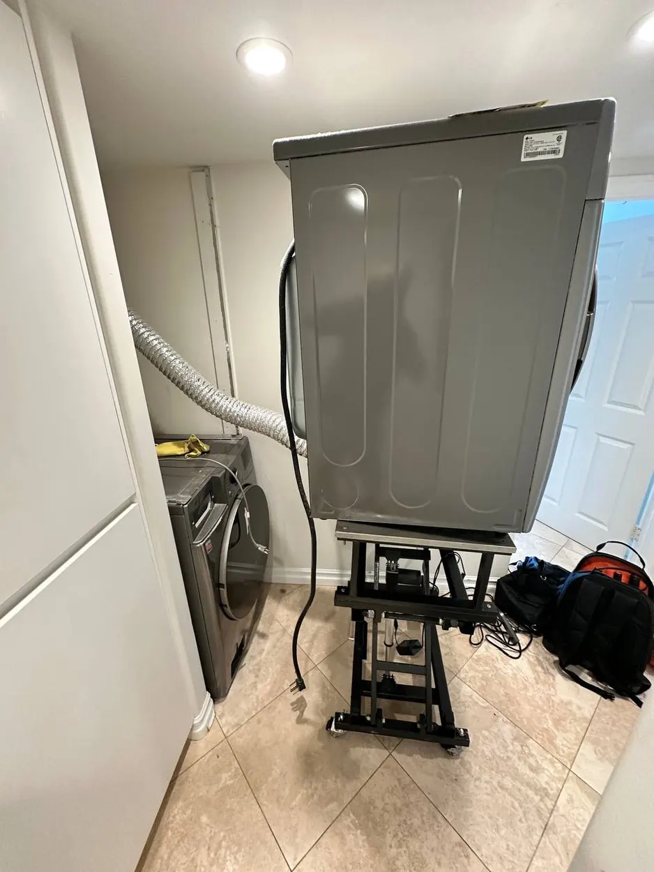 LG dryer lifted on a service jack during a repair in Escondido