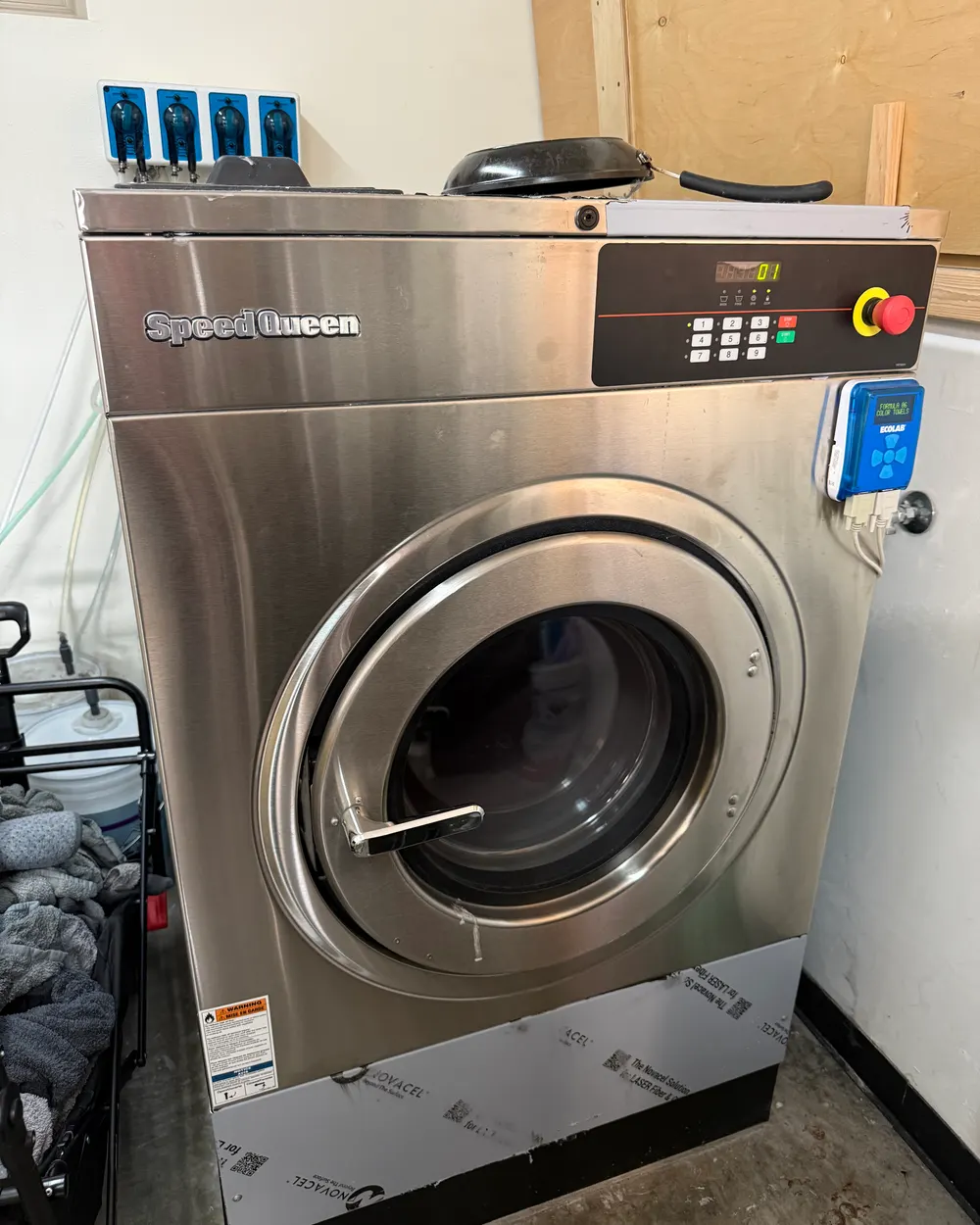 Commercial Speed Queen washer serviced at a North County business