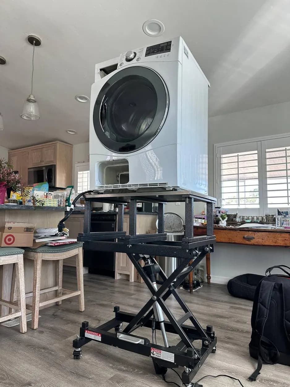 Dryer raised on a jack to service it in Carlsbad