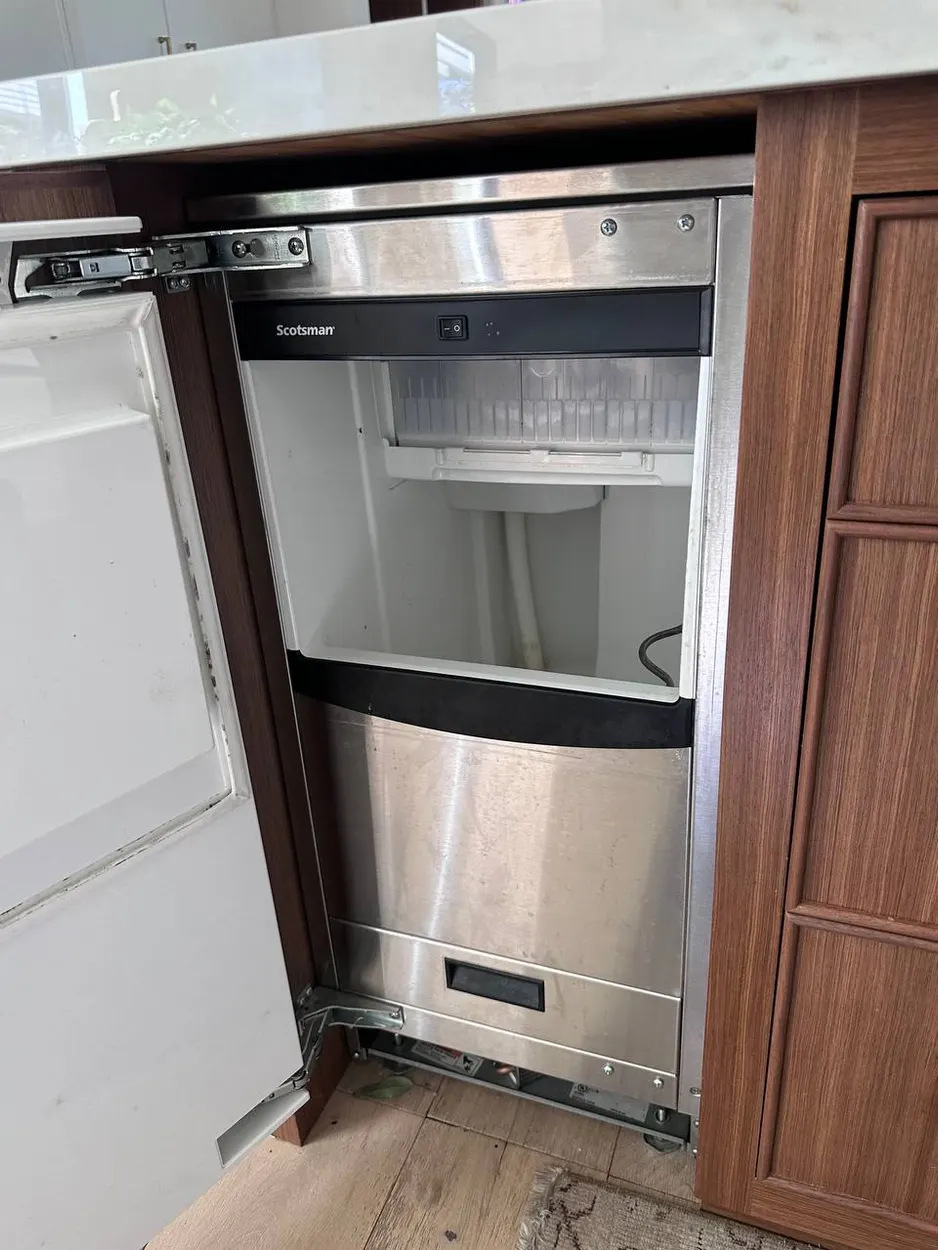 Undercounter ice maker opened up for repair in an Escondido home