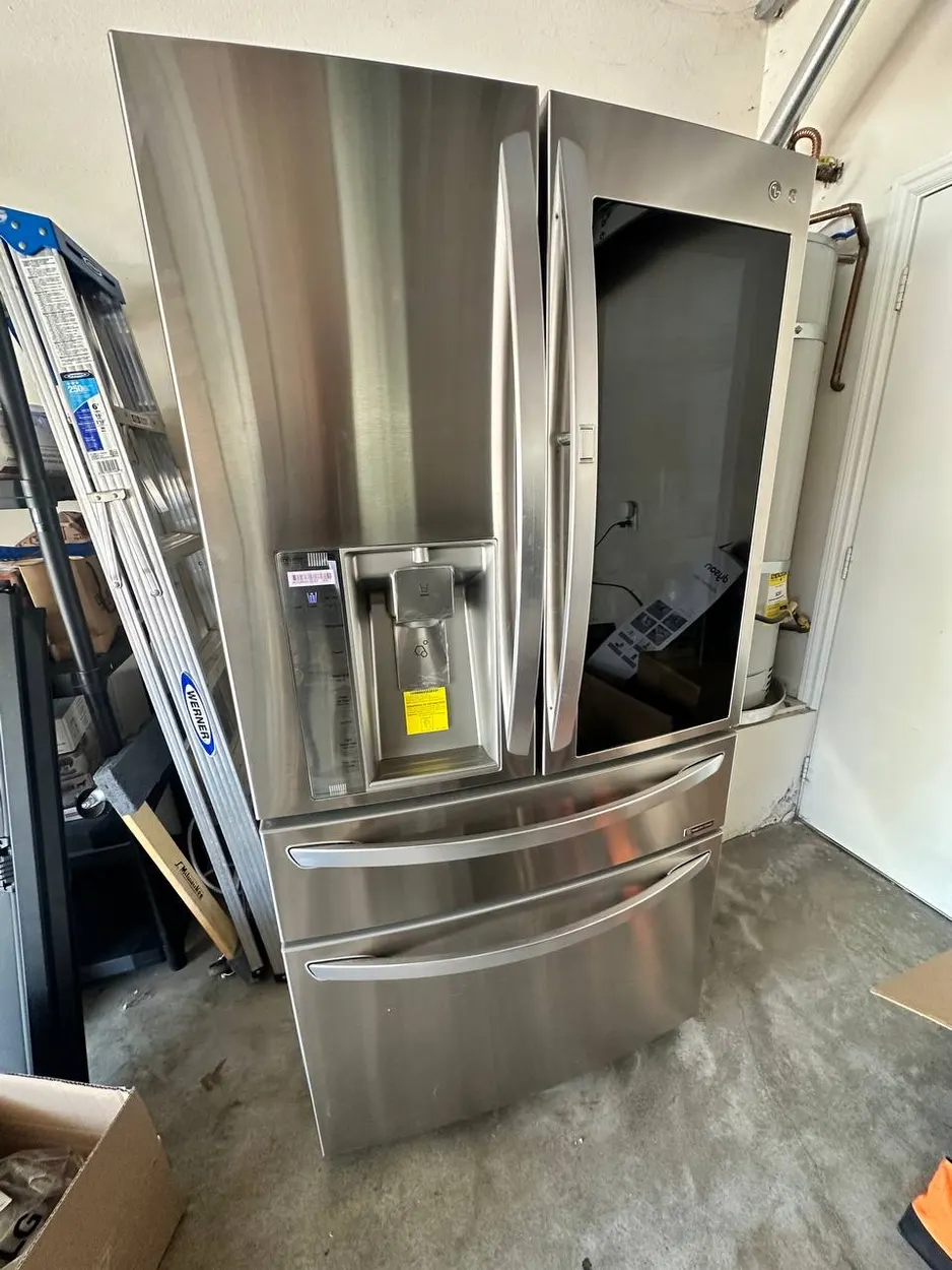 LG French-door refrigerator opened up for repair at an Escondido home