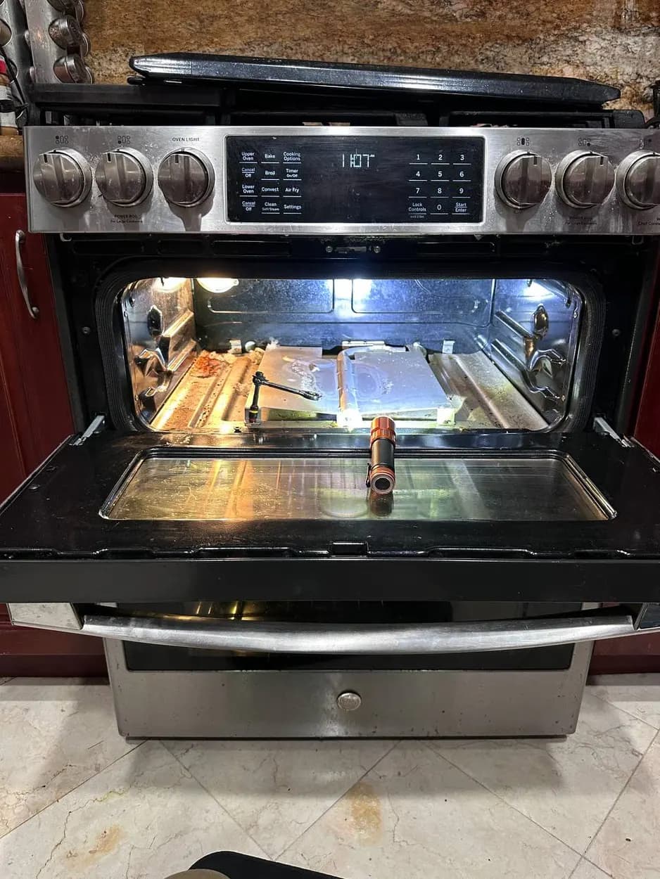 Range oven opened during a repair in Vista