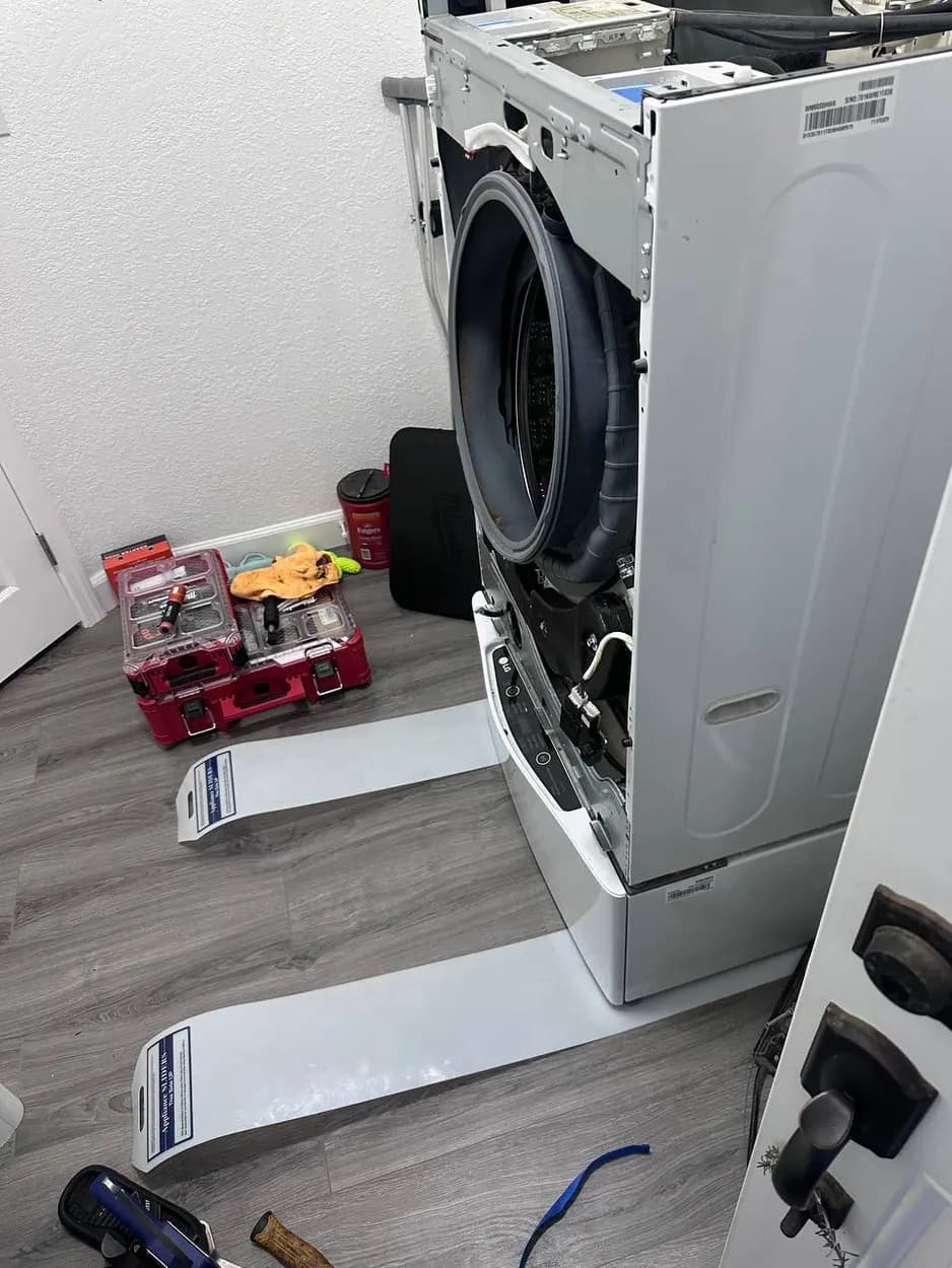 Front-load washer opened up for repair in Poway