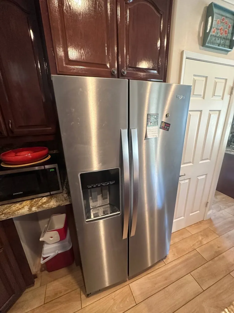Whirlpool side-by-side refrigerator after a repair in North County