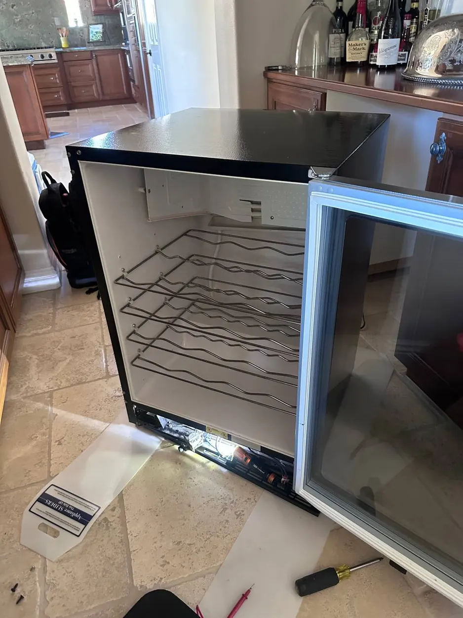 Wine cooler opened up for repair in Oceanside